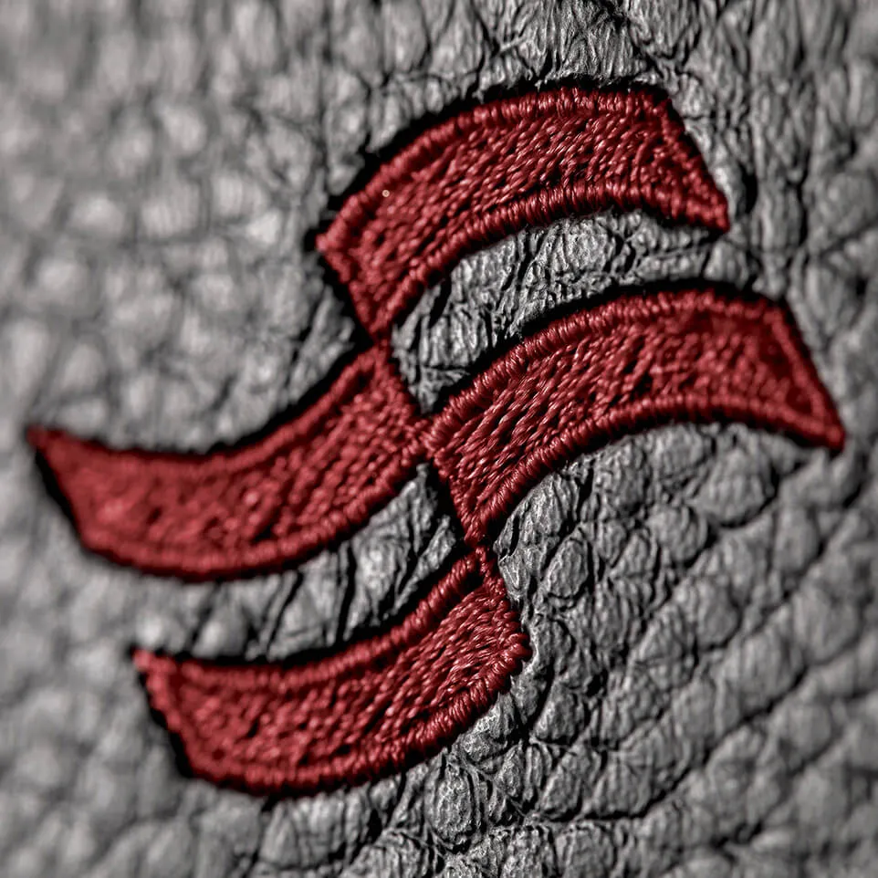 Embroidered Sirena logo on Sirena 68 leather upholstery