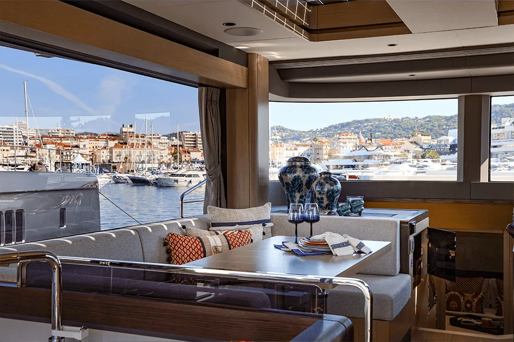 Saloon of a Sirena yacht overlooking Cannes harbour