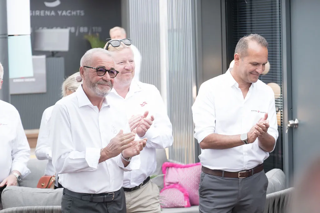 Guests applauding at the Sirena Yachts event in Cannes