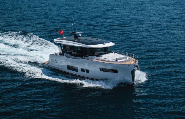 The Sirena 48 Coupé Hybrid yacht cruising elegantly on open waters, symbolizing innovation and respect for the sea.