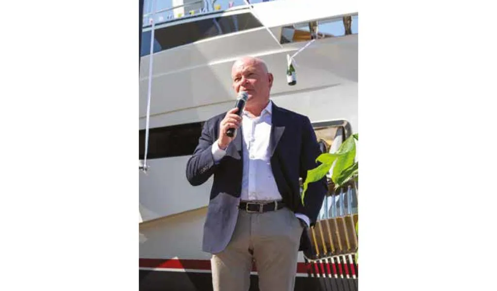 Master of Vitamins, owner of Vitaminas, steering a luxury Sirena yacht during an exclusive interview on the water