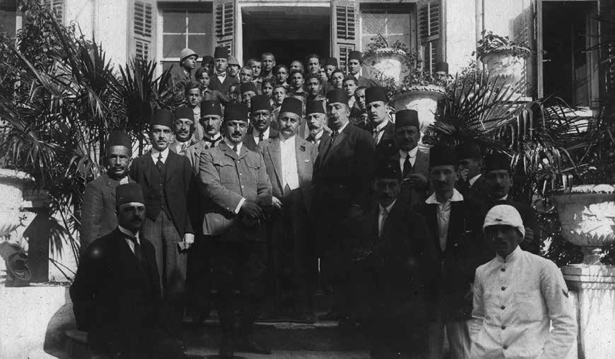 A historic group photo of Turkish sailors and leaders gathered for a pioneering sea journey in the early 20th century.